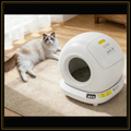 Cat resting beside the ApexClean self-cleaning litter system
